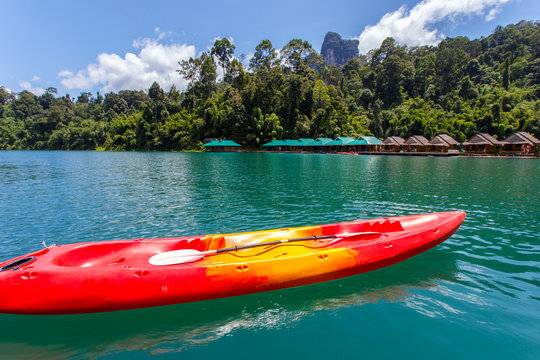 Canoe in a beautiful mountains lake forest and river natural attractions in Ratchaprapha Dam at Khao Sok National Park, Surat Thani Province, Thailand.