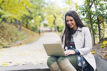 Using laptop at the park