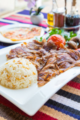 Turkish kebap meat with pilav rice and sides