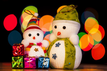 Festive snowman with Christmas light background