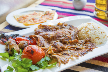 Turkish kebap meat with pilav rice and sides