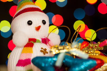 Festive snowman with Christmas light background