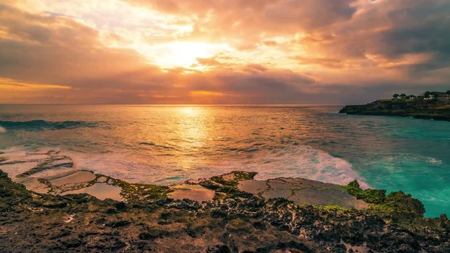 Timelapse Summer sunset at the rock beach in Nusa Lembongan, Bali, Indonesia