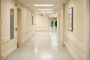 Bright white fluorescent lit sterile hospital hallway 
