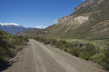 Fototapeta na wymiar Gravel road running through the remote landscape of Valle Chacabuco in northern Patagonia, Chile