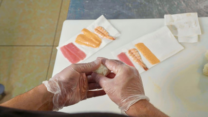 POV of rofessional chef making sushi personal view