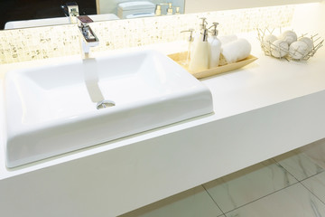 Interior of bathroom with sink basin faucet and mirror. Modern design of bathroom