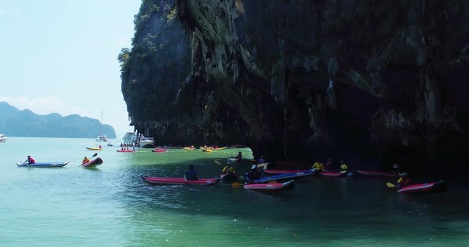 PHUKET, THAILAND, MARCH 2017:  Padling in small boats, through caves and alleys in Phi Phi Islands