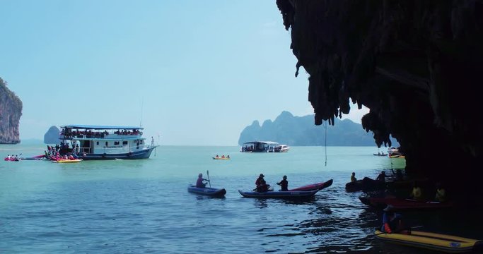 PHUKET, THAILAND, MARCH 2017:  Padling in small boats, through caves and alleys in Phi Phi Islands