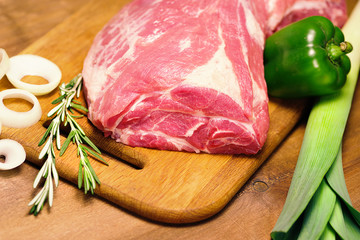 fresh meat on the table and other ingredients for cooking