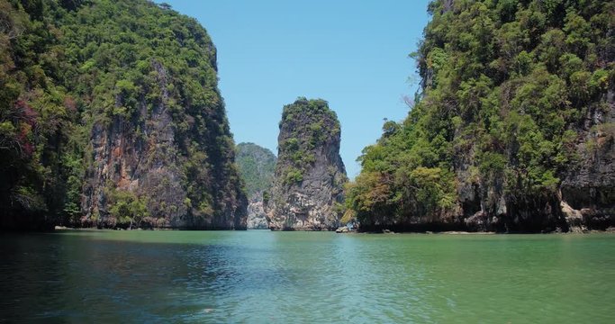PHUKET, THAILAND, MARCH 2017:  Padling in small boats, through caves and alleys in Phi Phi Islands
