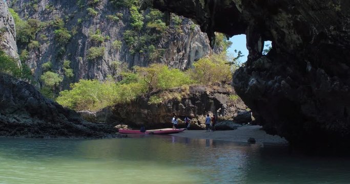 PHUKET, THAILAND, MARCH 2017:  Padling in small boats, through caves and alleys in Phi Phi Islands
