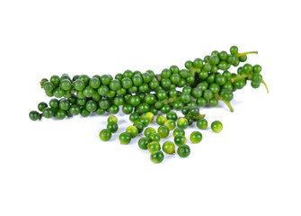 pile of green peppercorns on white background