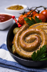Round fried sausages with vegetables