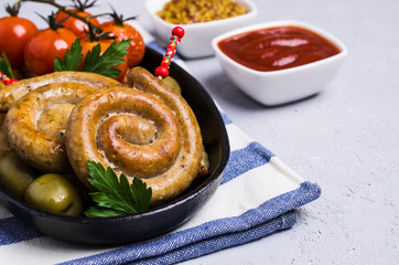 Round fried sausages with vegetables