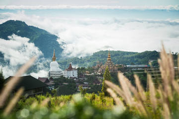 Big Buddha statue and pagoda on top of a hill with great views of the surrounding mountainous area at Wat Pha Sorn Kaew Temple in Khao Kho, Phetchabun Province, Thailand.