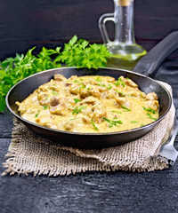 Meat stewed with cream on black board