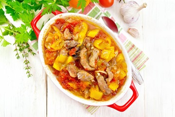 Ragout of meat and vegetables in brazier on board top