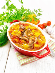 Ragout of meat and vegetables in brazier on kitchen towel