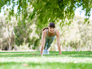 Young woman exercising in the park