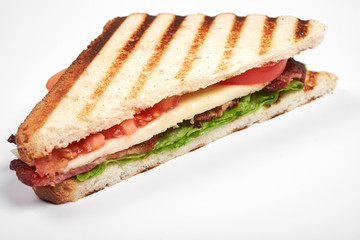 fresh sandwich close up with vegetables and meat isolated on white background