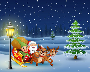 Santa claus and elf sliding in the snowing hill