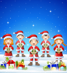 Happy kid wearing santa costume singing in the winter background with balls