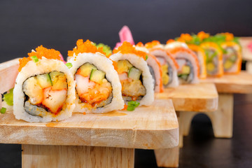 Japanese Cuisine - Sushi Roll on wood plate 