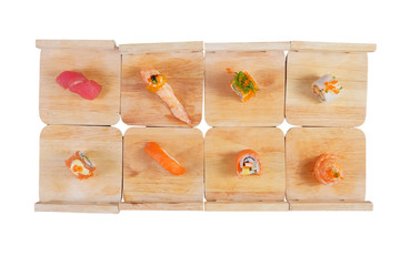 Japanese Cuisine - Sushi Roll on wood plate on white background