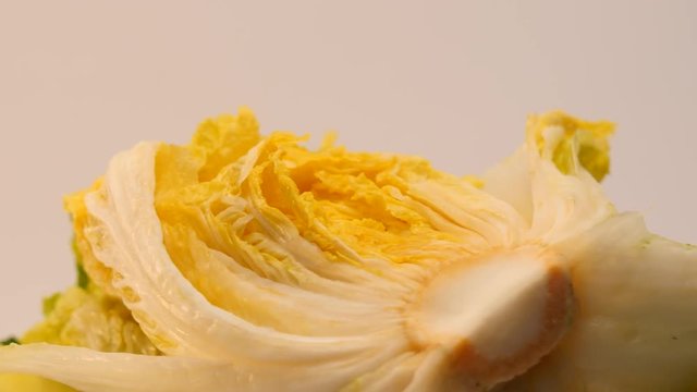 Rotate salt pickled cabbage for kimchi on a dish.
