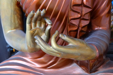 Fototapeta premium Body part. Hand Buddha statue in temple Thailand.