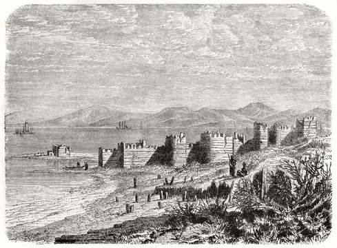 Ruins of an ancient stronghold on a beach rich of mediterranean vegetation. Old view of Ayas castle Yumurtalik Turkey. Created by Grandsire and Gauchard published on Le Tour du Monde Paris 1862