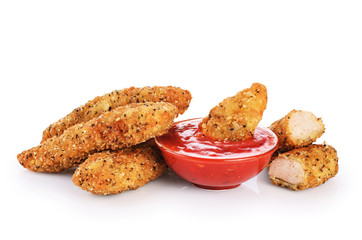 Chicken strips and ketchup isolated on white background.