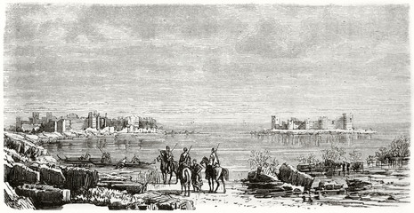 Ancient horseback people on a rocky shore in front of a sea stronghold ruins. Corycus Cilicia (in our day Turkey). Created by Grandsire and Pontenier published on Le Tour du Monde Paris 1862