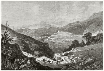 Ancient south american landscape rich of vegetation with a path leading to a city trough the hills. Old view of Guanajauto Mexico. By De Berard after Niebel published on Le Tour du Monde Paris 1862