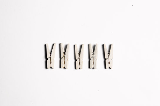 five white clothespins