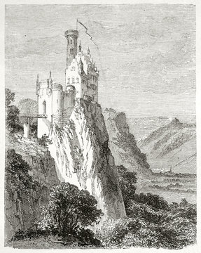 White medieval castle on top of a high peak over the german forest. Old view of Lichtenstein castle Baden-Wurttemberg Germany. Created by Lancelot published on Le Tour du Monde Paris 1862