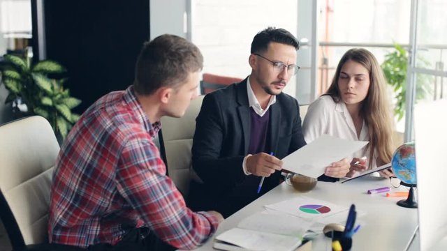 Business coworkers discussing new ideas and brainstorming in a modern office