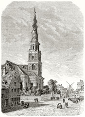 Ancient vertical illustration representing a high belltower in a medieval little town. Old view of Our saviour church in Copenhagen Denmark. Created by Therond published on Le Tour du Monde Paris 1862