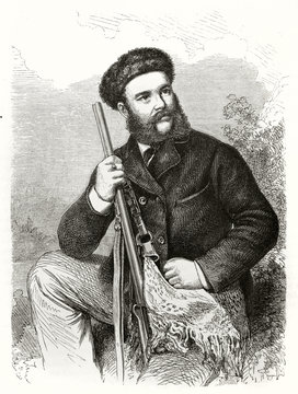 Ancient bearded man posing seated with his shotgun and wearing a fur cap.  Theodore von Heuglin (1824 - 1876) German explorer and ornithologist. By Handamard and Hildebrand on Le Tour du Monde 1862