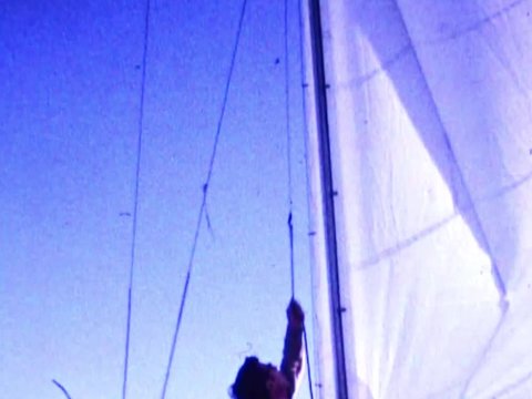 Raising the jib sail while sailing in open ocean waters during spring of 1972