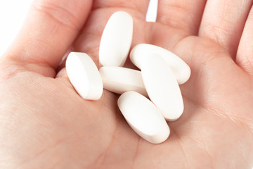 Fototapeta na wymiar pills in woman hand