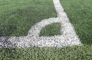 Close up on football field with artificial grass