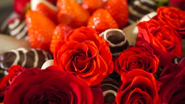 Bouquet with rose and strawberry in chocolate frosting. Rotation movie.
