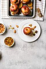 Baked apples with granola, cinnamon, nuts and hone