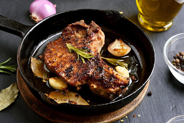 Grilled pork steak in frying pan