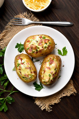 Baked potatoes with bacon, green onion and cheese