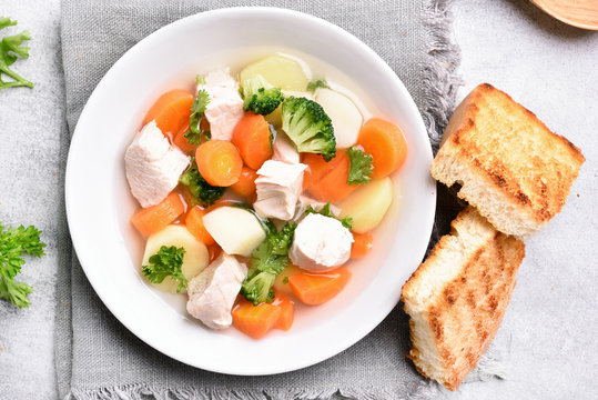 Healthy soup from carrot, potato, broccoli and chicken breast