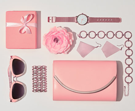 Fashion. Woman Accessories Set. Flat lay. Trendy Watch, Summer Sunglasses, Glamour fashion Pink Clutch. Flower. Luxury Stylish Spring lady. Vanilla Pink Color