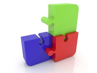 Three puzzle pieces in red,blue and green colors